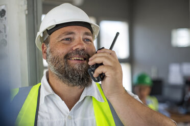 Quarry worker talking on radio device - ZEF13749