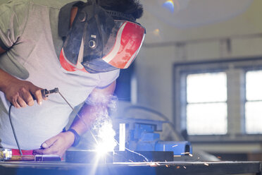 Mechanic welding in car workshop - ZEF13790