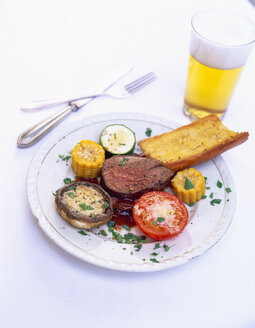 Beef fillet with grilled vegetables and glass of beer - PPXF00068