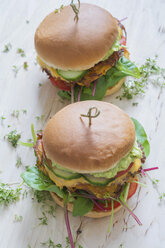 Two veggie burgers with sweet potato patties, avocado dip, cheese and vegetables - ODF01510