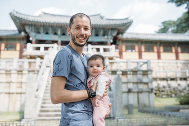South Korea, Gyeongju, father traveling with a baby girl in Bulguksa Temple - GEMF01644