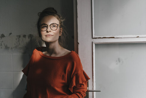 Young woman with glasses in sunlight - KNSF01492