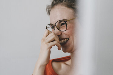 Portrait of happy young woman with glasses - KNSF01496