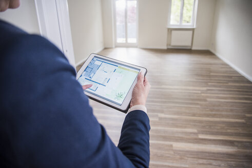 Woman using tablet in smart home - UUF10795