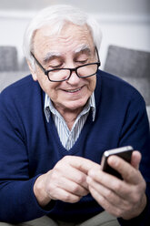 Senior man using smartphone - WESTF23295