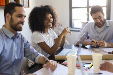 Happy business people having a meeting in office - GIOF02615