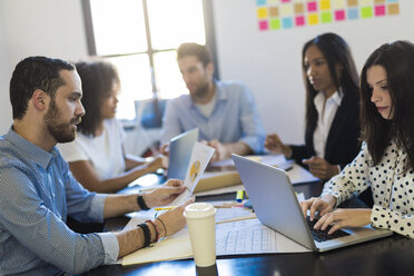 Business people having a meeting in office - GIOF02622