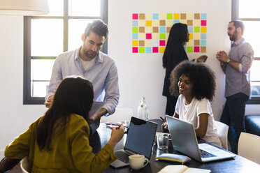 Business people having a meeting in office - GIOF02679