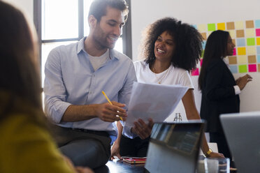 Confident business people having a meeting in office - GIOF02681