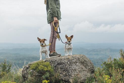 Woman walking with her two dogs - JPF00213