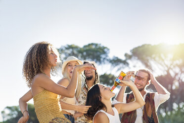 Happy young people outdoors having a good time - ZEF13910