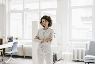 Businesswoman in office looking determined - KNSF01601