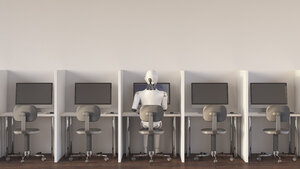 Roboter sitzt im Büro und arbeitet allein - AHUF00364