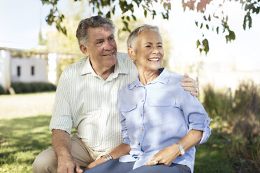 Happy senior couple in garden - ZEF13990