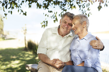 Happy senior couple in garden - ZEF13991