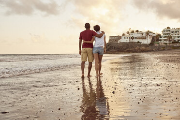 Spain, Canary Islands, Gran Canaria, back view of couple in love walking on the beach - PACF00011
