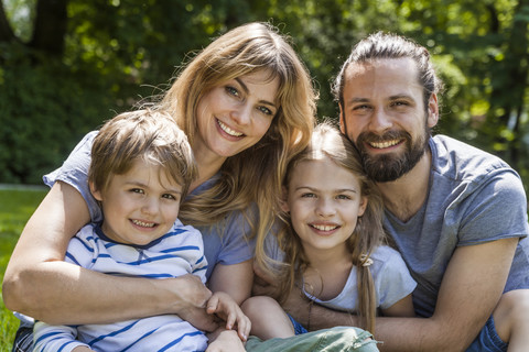 Portrait of happy family outdoors stock photo