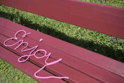 Word enjoy on a bench - PSTF00036