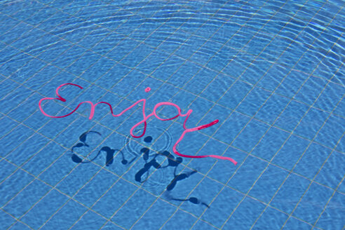 Word enjoy in water of a swimming pool - PSTF00041