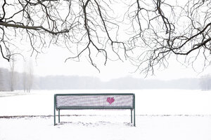 Embroidered heart at bench in winter landscape - PSTF00046