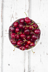 Bowl of cherries on white wood - LVF06156