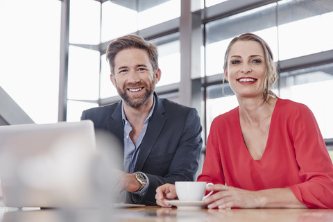 Portrait of smiling colleagues in office stock photo