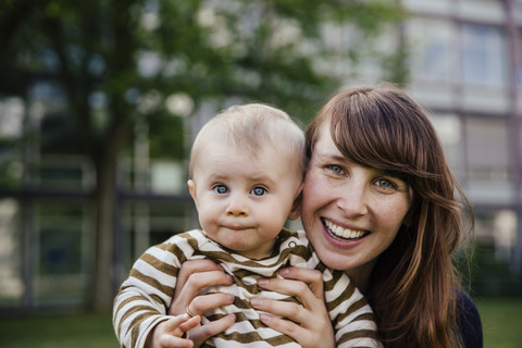 Portrait of happy mother with her baby boy stock photo