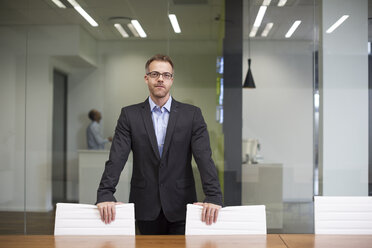 Manager standing in office boardroom - ZEF13993