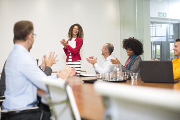 Business people applauding during a meeting in boardroom - ZEF13998