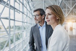 Businesswoman and businessman at the airport - RORF00941