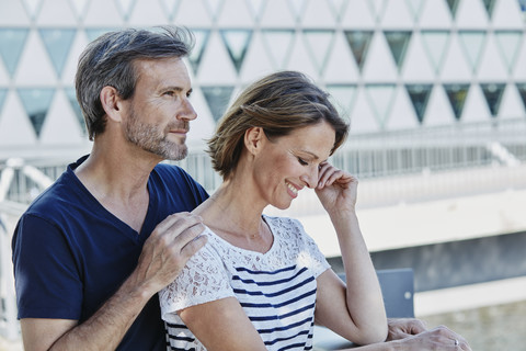 Affectionate mature couple outdoors stock photo