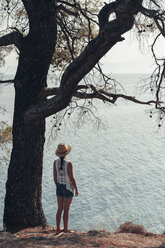 Greece, Chalkidiki, young woman looking at the sea - BZF00372