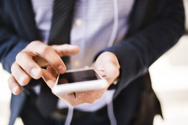 Close-up of businessman using smartphone - HAPF01748