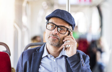 Man on smartphone in bus - HAPF01774