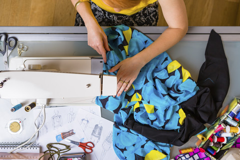 Fashion designer working with sewing machine, top view stock photo