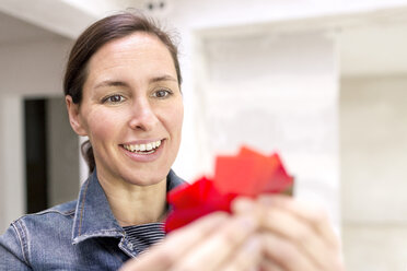 Portrait of smiling architect with colour chart - DMOF00026