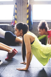 Group of young people exercising in gym - HAPF01800