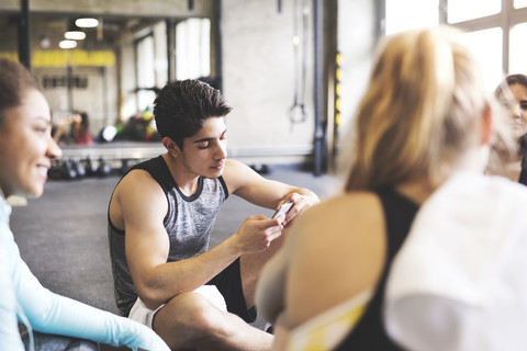 Group of young people having a break in gym stock photo