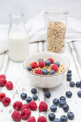 Bowl of granola with raspberries and blueberries - LVF06197