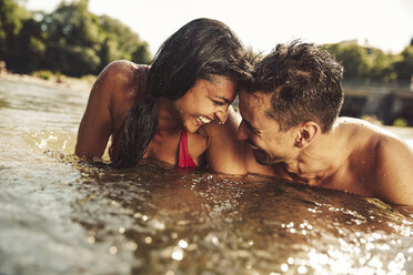 Happy couple bathing in river - SUF00151