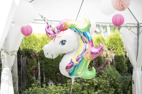 Decoration with unicorn balloon and lampions in a garden stock photo