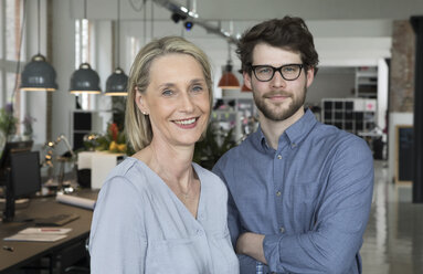 Portrait of a young businessman and a mature businesswomen - RBF05816