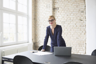 Successful businesswoman standing in her office - RBF05827