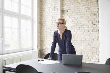 Successful businesswoman standing in her office - RBF05828