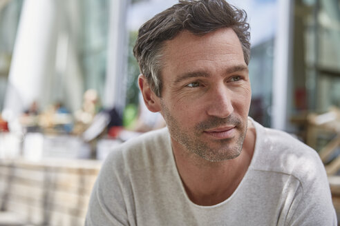 Portrait of man at an outdoor cafe - SUF00215