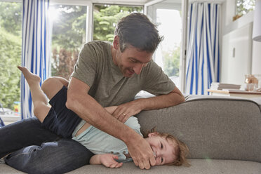 Father playing with little son at home - SUF00226