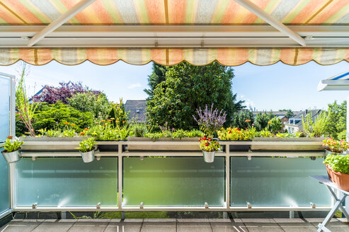 Flowers on balcony with awning - FRF00527