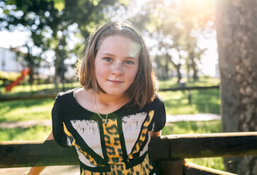 Portrait of freckled girl outdoors - MGOF03447