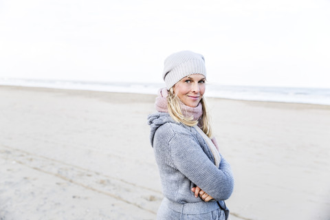 Portrait of smiling woman on the beach stock photo