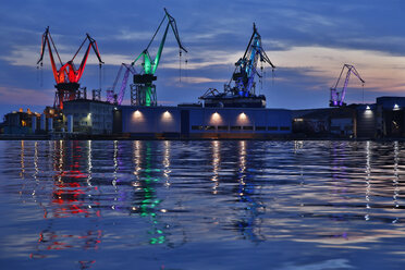 Croatia, Istria, lighted harbour cranes at twilight - MAEF12372